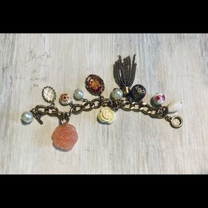 Beautiful rose charm bracelet in shades of gold, rose, pink, cream, and pearl.